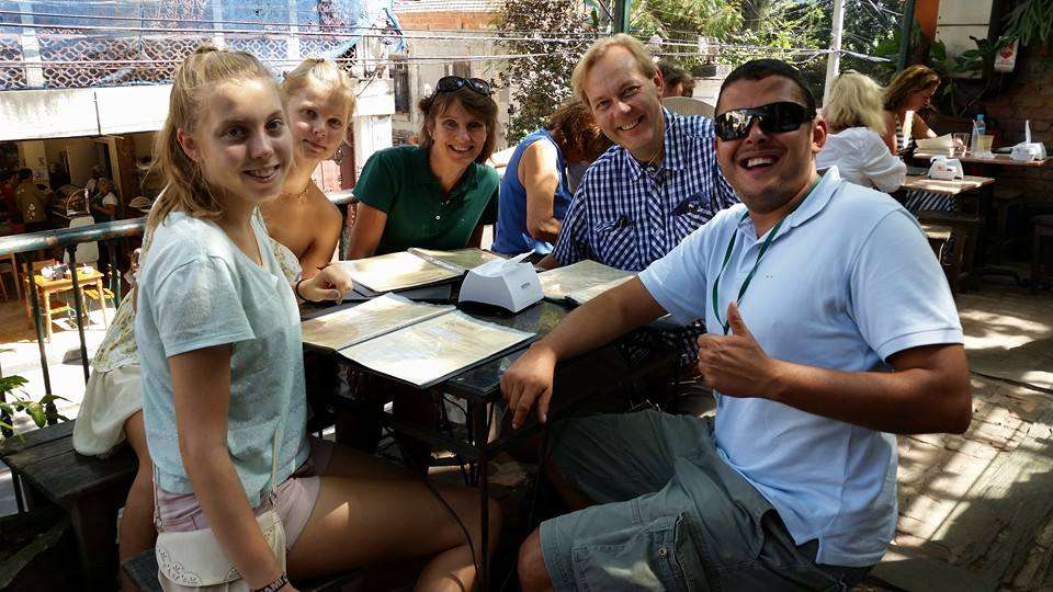 Small group enjoying personalized walking tour through colorful streets of Santa Teresa Rio with local guide