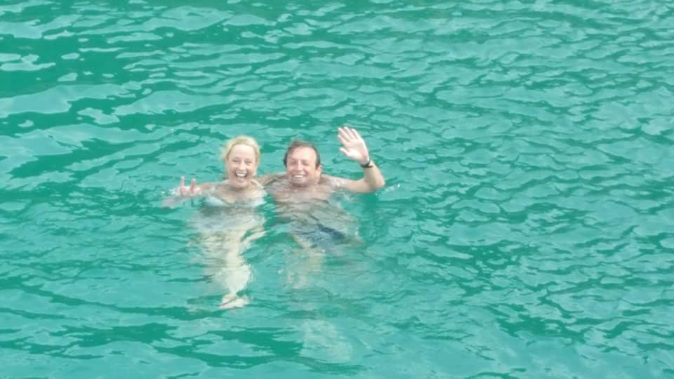 Snorkeling in transparent blue waters of Arraial do Cabo marine reserve on guided day tour from Rio de Janeiro