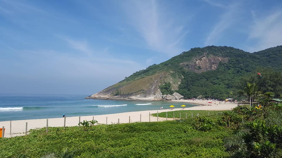 Grumari Beach wild natural landscape on Prainha Grumari day tour showing golden sand and Atlantic forest in Rio