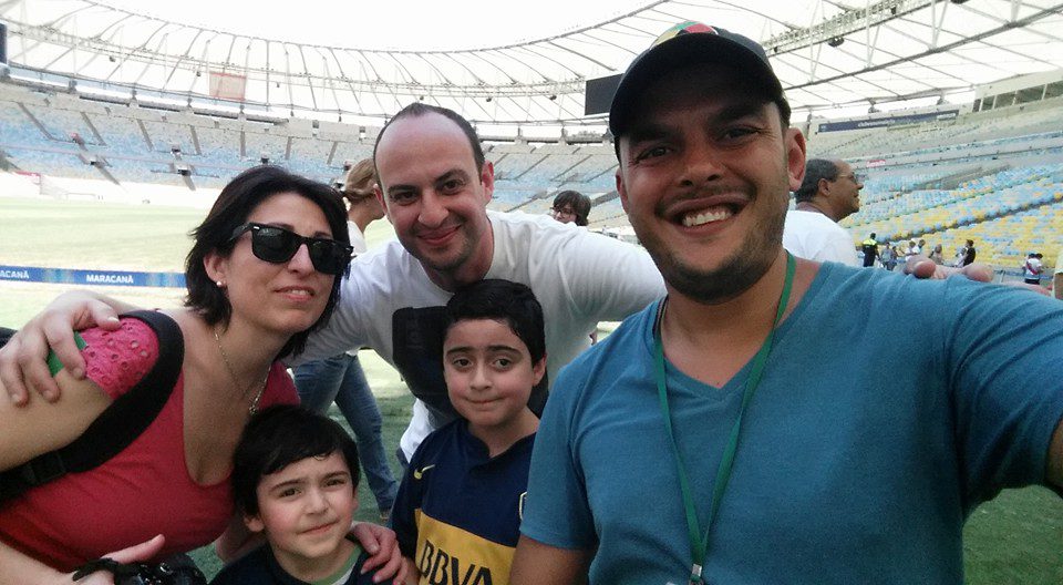 Family smiling inside Maracanã Stadium during a Rio de Janeiro Family Friendly Tour with Rio Cultural Secrets, discovering Brazil’s football passion and history.