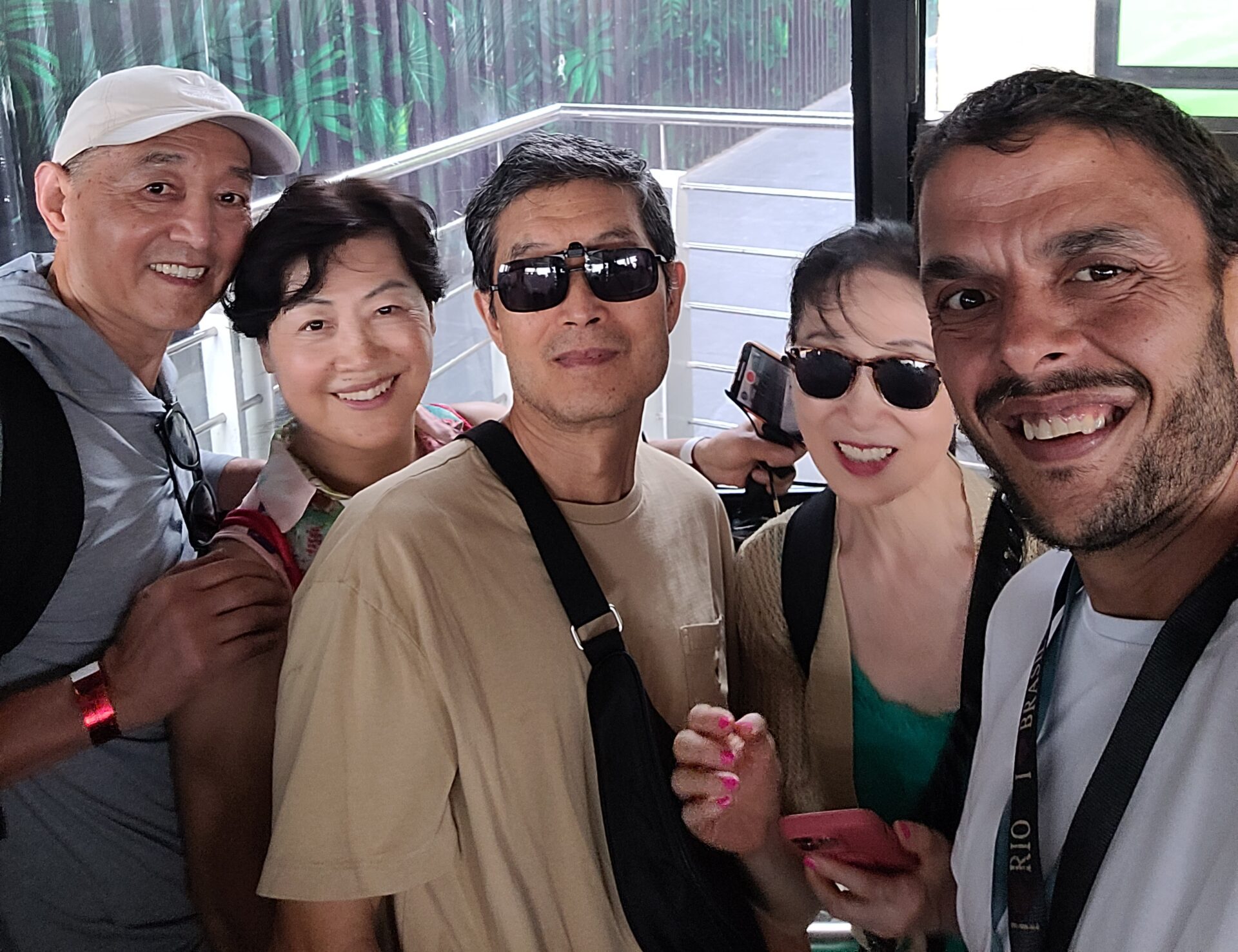 Tour guide Fabio with tourists on private city tour Christ and Sugar Loaf exploring Rio de Janeiro's iconic landmarks