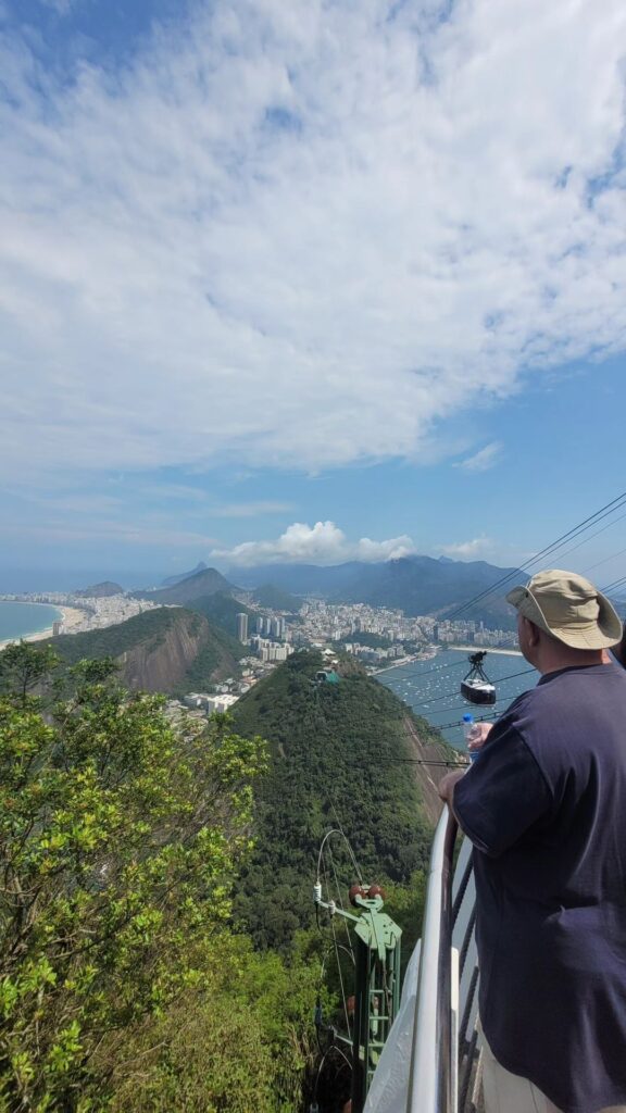 View of Copacabana and the cable car from Sugarloaf Mountain during a multi-day tour in Rio