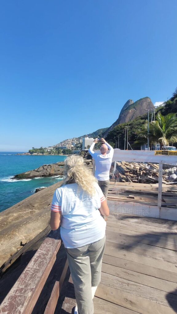 Travelers photographing Dois Irmãos mountain during a private trip to Rio de Janeiro