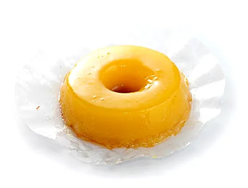 Quindim, a glossy yellow Brazilian coconut and egg yolk custard, a classic dessert to try in Rio de Janeiro
