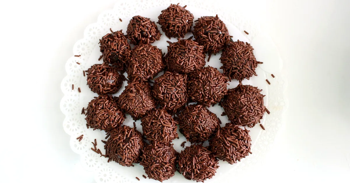 Brigadeiros, the most famous Brazilian dessert, covered in chocolate sprinkles on a white plate in Rio de Janeiro