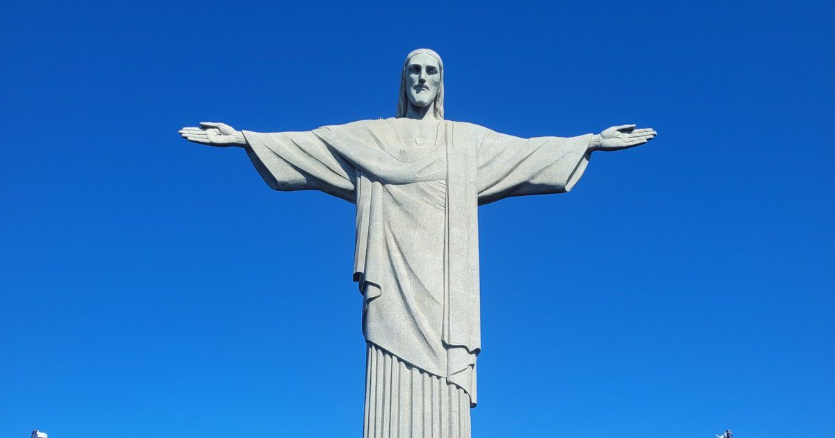 Christ the Redeemer statue with open arms against a clear blue sky – can you climb inside Christ the Redeemer?