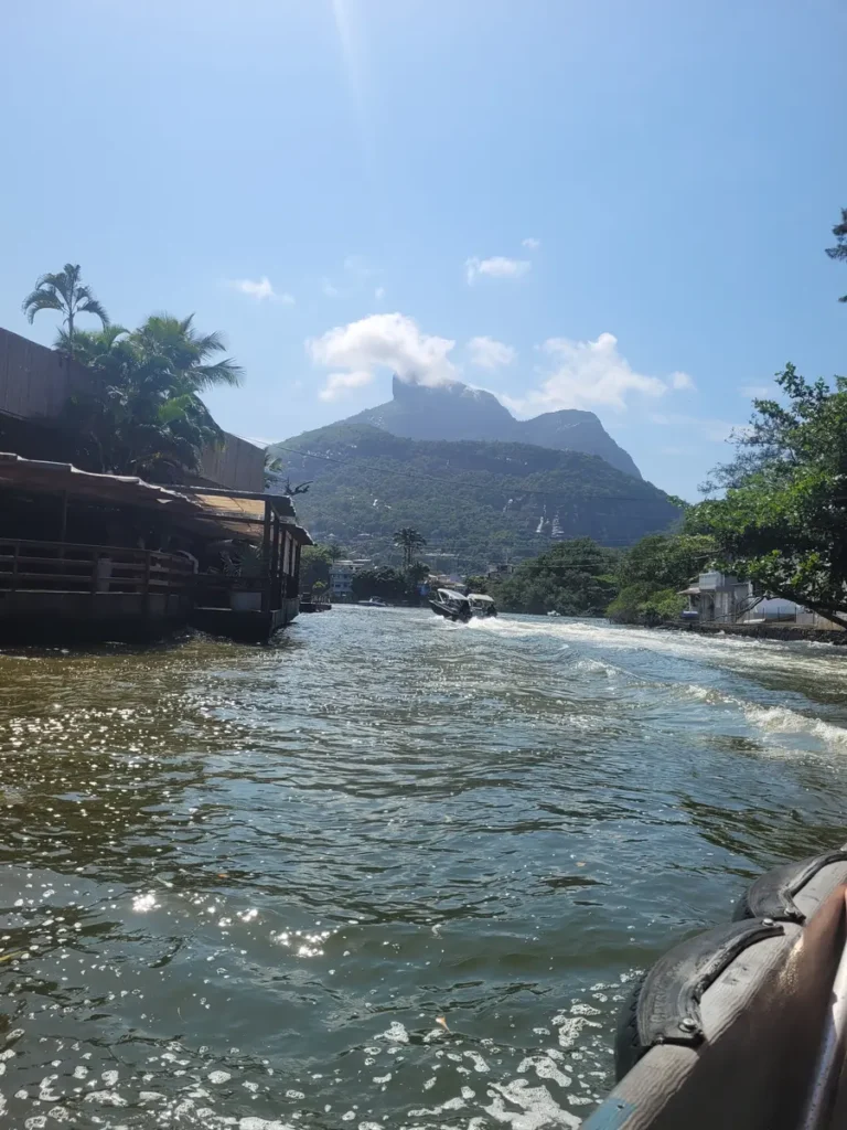 Water taxi crossing the canal to Ilha da Gigóia with Pedra da Gávea behind, an off the beaten path spot in Rio